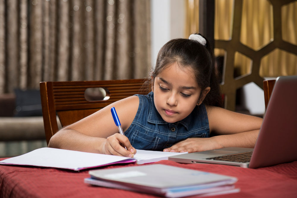 Image of young girl being tutored and doing SEA Lessons at PTI in East Trinidad Arima